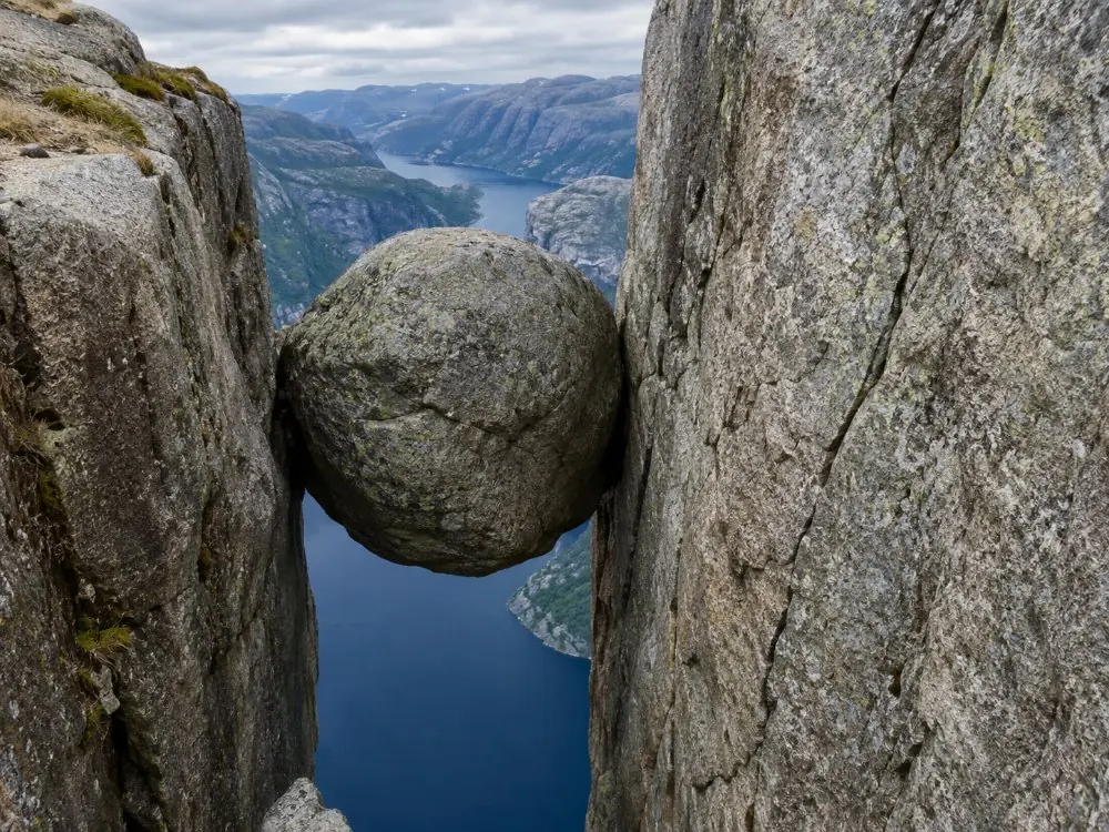 The Kjeragbolten boulder wedged in the crevice high above the Lysefjord
